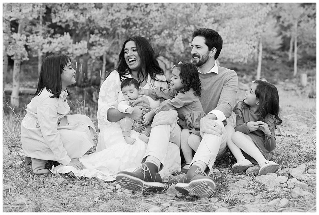 Happy family laughes together during a las vegas portrait photography session.