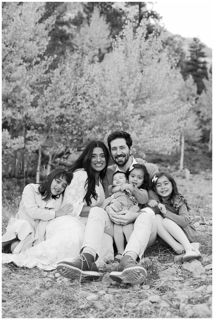 Beautiful black and white Family snuggled together captured by a portrait photographer in las vegas.